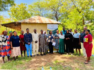 RHAI team with CHWs, local leaders, and CEO Wiliam Kisima at Kahe Magharibi project meeting.